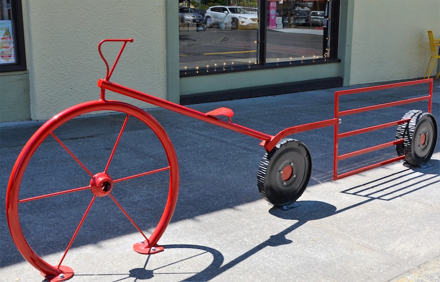 Red bike rack wagon next to iCandy.