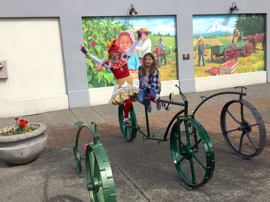 Cha Cha the clown and child on new bike rack.