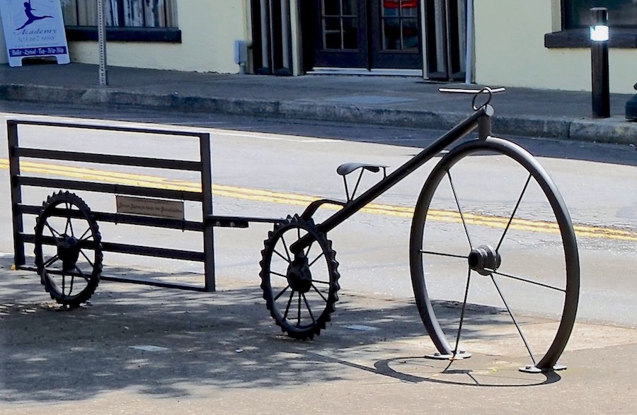 Black bike rack near side of Gresham History Museum.