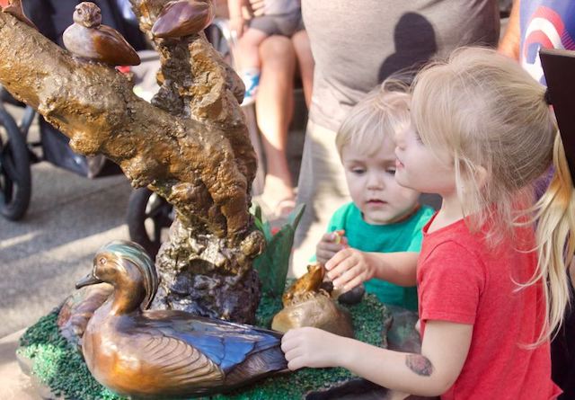 Children admiring Bless Our Nest