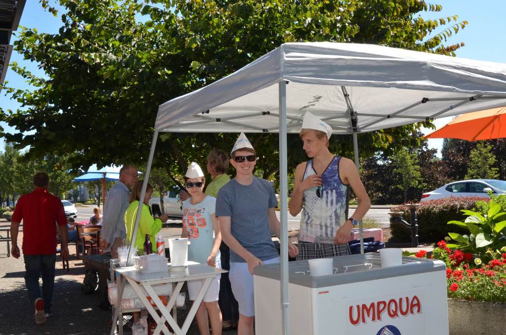 People Serving ice cream at the social.