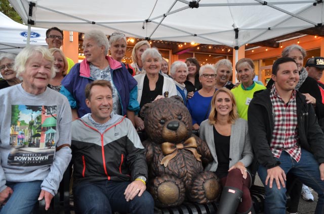 Everyone sitting with the Teddy Bear